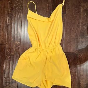 Precious yellow romper! Pockets and Laces up the back. Comfortable and cute!